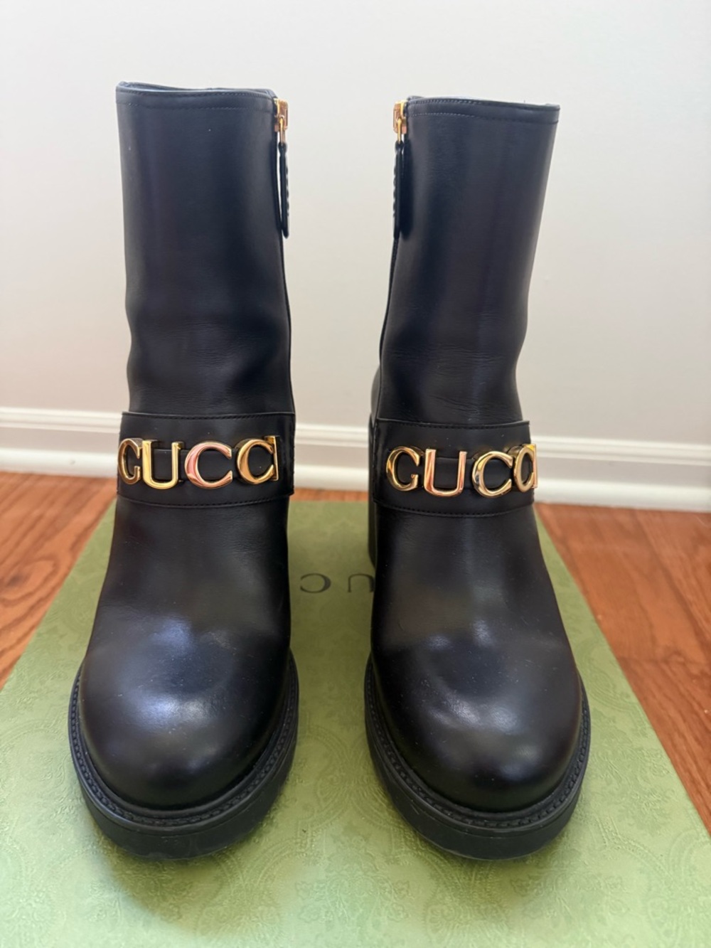 Gucci Black Leather Ankle Boots with Gold Logo Strap